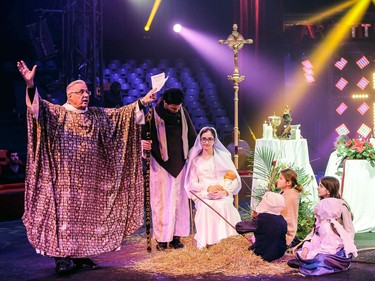 Father Jean Rouet celebrates Christmas mass in the Arlette Gruss circus tent in Bordeaux, southwestern France, on Christmas eve, December 24, 2016.