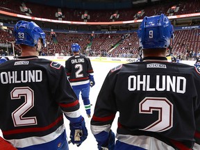 Henrik Sedin #33 and Jack Skille #9 of the Vancouver Canucks wear Mattias Ohlund jerseys for warmup before their NHL game against the Tampa Bay Lightning at Rogers Arena December 16, 2016 in Vancouver, British Columbia, Canada. Mattias Ohlund was inducted into the  Rogers Arena Ring of Honour before the NHL game between the Lightning and the Canucks.