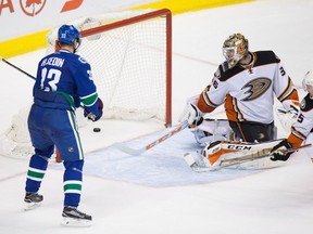 Henrik Sedin scores against Anaheim Ducks' goalie John Gibson on Thursday December 1, 2016.