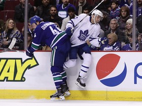 Vancouver Canucks' Erik Gudbranson checks Toronto Maple Leafs' Nazem Kadri during first-period action at The Rog Saturday night. At just 24, Gudbranson seems to be a grizzled vet on the Canucks.