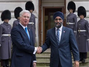 Defence Secretary Sir Michael Fallon (left) greets Canadian Minister of Defence Harjit Sajjan outside the Foreign Office ahead of a London summit with defence ministers from the coalition of countries fighting IS, also known as Daesh, in Iraq and Syria on December 15, 2016 in London, United Kingdom.