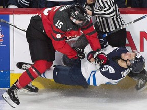 Canada's Jeremy Lauzon collides with Finland's Aaro Vidgren during second period pre-tournament exhibition hockey action in Montreal last Monday. Playing on home ice with a team built for speed and tenacity could be the right combination to put Canada in the gold medal hunt at the world junior hockey championship.