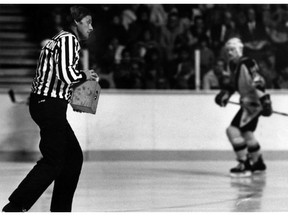 Jim Christison removes a remote camera during a Canucks game in 1983.