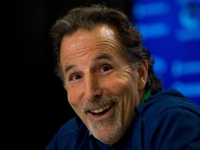 FILE - In this April 14, 2014, file photo, Vancouver Canucks' head coach John Tortorella laughs after a reporter mistakenly called him Mike during an end of season news conference in Vancouver, British Columbia. After an 0-7 start, the Blue jackets have fired coach Todd Richards and replaced him with John Tortorella, Wednesday, Oct. 21, 2015.(AP Photo/The Canadian Press, Darryl Dyck, File)