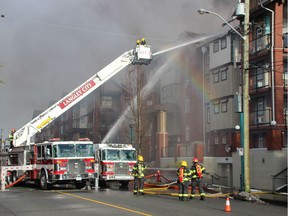 Langley City and Langley Township crews battle a large apartment fire in Langley at 5650 201A Street , Sunday morning, December 11, 2016.