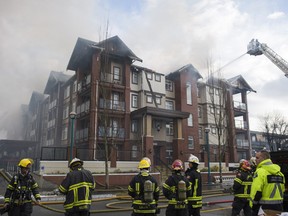 Firefighters battle a fire in the Paddington Station condo complex in the 5600-block of 201A Street in Langley on Sunday.