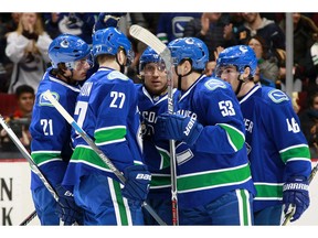 The Vancouver Canucks celebrate a goal by Loui Eriksson #21 against the Los Angeles Kings during their NHL game at Rogers Arena December 28, 2016 in Vancouver, British Columbia, Canada.