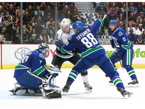 Alexander Edler and Nikita Tryamkin take care of business in front of the Canucks' net.