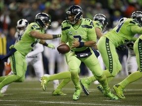 Quarterback Russell Wilson #3 of the Seattle Seahawks prepares to handoff the ball against the Los Angeles Rams at CenturyLink Field on December 15, 2016 in Seattle, Washington.