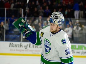 Utica Comets goalie Thatcher Demko acknowledges the home fans after his star turn on Nov. 23 against the Syracuse Crunch, stopping 31 of 32 shots he faced in a 2-1 Comets victory.