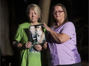 Audrey deOliveira, left, and Debbie Dyer, mother of Beckie Dyer, hold a picture of their children, who were killed in a motor vehicle accident Oct. 19, 2010 in Pitt Meadows.