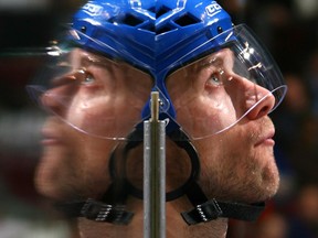 [PNG Merlin Archive] VANCOUVER, CANADA - NOVEMBER 29:   Mattias Ohlund #2 of the Vancouver Canucks is reflected in the glass as he walks onto the ice during a game against the Columbus Blue Jackets at General Motors Place on November 29, 2007 in Vancouver, British Columbia, Canada.  The Canucks won 2-0.