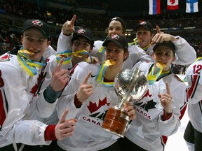 Members of Team Canada celebrate their victory against Team Russia during the gold medal game at the World Junior Hockey Championships at General Motors Place on January 5, 2006.