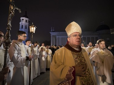 Priests and clergy attend the Christmas celebration midnight Mass at the Cathedral-Basilical in Vilnius, Lithuania, Saturday, Dec. 24, 2016. Over 80 percent of Lithuanians are Christians who celebrate the festival of Christmas on Dec. 25.