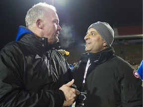 QUEBEC CITY, NOVEMBER 28, 2015 -- University of B.C. Thunderbirds football coach Blake Nill, left, talks with benefactor and alumnus Dave Sidoo after UBC defeated the University of Montreal to win the Vanier Cup in Cuebec City. REDIT: Rich Lam, UBC Athletics [PNG Merlin Archive]