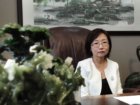 Lawyer Hong Guo poses for a photo in her office in Richmond, BC.
