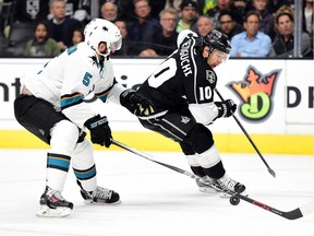 Devin Setoguchi of the Kings attempts a move on David Schlemko of the Sharks.