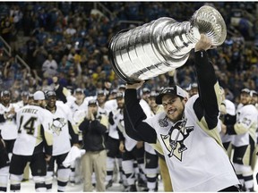In this June 12, 2016, file photo, Pittsburgh Penguins center Sidney Crosby raises the Stanley Cup after Game 6 of the NHL hockey Stanley Cup Finals against the San Jose Sharks in San Jose, Calif. A repeat Stanley Cup champion hasn't happened in the league since the Red Wings in 1997 and 1998.