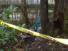 Postmedia News found a tent in the area where the B.C. Coroner's office said a 19-year-old girl who had recently aged out of care died. A large, turquoise tent was partially roped off by police tape in the bushy area about 15 metres from the SkyTrain tracks and King George Highway.