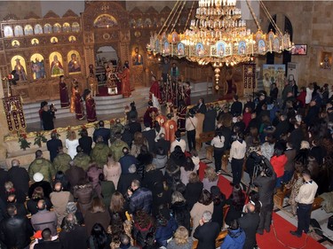 Greek Orthodox Patriarch of Antioch and All East John X Yazigi leads prayers during Christmas mass at the Elias Orthodox Church in Aleppo on December 24, 2016