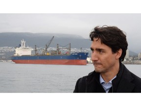 Prime Minister Justin Trudeau is in Calgary today for the first time since approving two major pipeline projects and rejecting another. A freighter is seen in the background as Prime Minister Justin Trudeau tours a tugboat in Vancouver Harbour, Tuesday, Dec.20, 2016.
