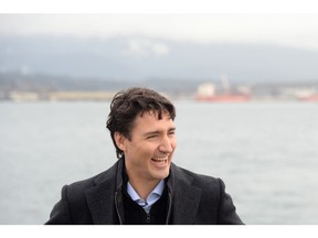 Prime Minister Justin Trudeau has a laugh as he tours a tugboat in Vancouver Harbour, Tuesday, Dec.20, 2016.