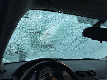 A vehicle damaged by falling snow bombs on the Port Mann Bridge on Monday, Dec. 5, 2016.