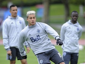 Vancouver  B.C.  April 5, 2016  Vancouver Whitecaps Erik Hurtado 19 jumps infront of his team mates during practice in the rain at U.B.C. training facility  on April 5, 2016      Mark van Manen /PNG Staff photographer   see Marc Weber Vancouver Sun  Province Sports  /and Web. stories.    00042510A [PNG Merlin Archive]