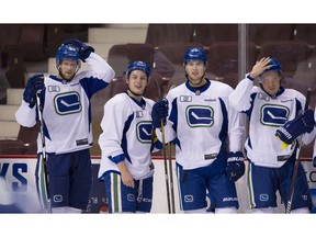 Vancouver  B.C.  December 27, 2016  Working hard-- Vancouver Canucks Alex Edler 23, (left) and team mates in practice ahead of Kings game on Wednesday in Rogers Arena on  December 27, 2016   Mark van Manen/ PNG Staff  photographer   see  Iain MacIntyre Vancouver Sun/Province Sports     / Features stories  and Web.  00047031A [PNG Merlin Archive]