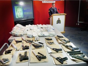 Surrey RCMP display some of the drugs, cash and firearms seized in 2006 from an apartment linked to Malakias Gerald Swales.