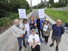 Left to Right:  Mark Battersby, Gail Davidson, Elvira Lount, Adiran Levy, Grace Woo, David Fink. Sitting is Diana Davidson beside Maple Crecent at Arbutus Corridor in Vancouver, BC. August 3, 2016.