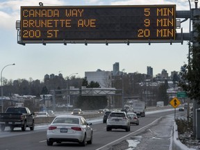 Digital boards showing drivers the estimated travel times to destinations further down the road, on the Trans-Canada Highway in Vancouver, BC Tuesday, December 6, 2016.