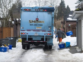 Recycling is collected just after noon from the 1000-block E. 13th Avenue in Vancouver, BC Friday, December 30, 2016.