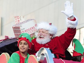 Santa Claus waves to the crowd from his sleigh on Sunday in the 13th annual Rogers Santa Claus Parade in downtown Vancouver.