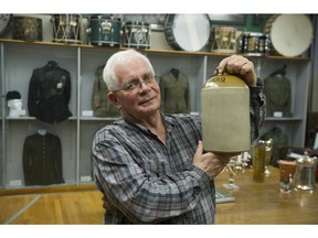 Retired Col. Keith Maxwell holds up Tiny Seymour's rug jum at the British Columbia Regiment's museum on Beatty Street.