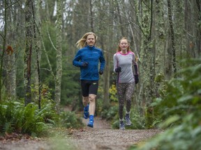 Ultra-runners Cody Callon and Alicia Woodside train on a trail near Spanish Banks recently. ‘I guess it’s competition with myself, to see where that edge is,’ Callon says of his attraction to ultra-running. ‘How far can I go? What else can I do? I can for sure finish a 100-miler, and maybe I could do well there, too. I’d like to find that out.’