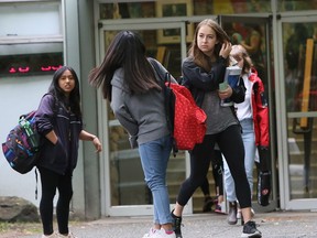 Students leave King George Seconday Thursday afternoon. The provincial government has announced they are scrapping provincial exams next school year.
