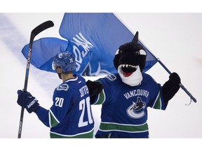 Vancouver Canucks' mascot Finn fist-pumps centre Brandon Sutter at Rogers Arena earlier this season. Want to dump Finn? You can vote to do so in our online poll, but why would you want to do that? He plays a drum. And he makes kids smile.