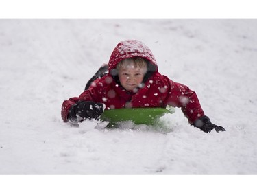 Declan Cavanaugh concentrates while sliding down a hill at Queen Elizabeth Park in Vancouver, BC, December, 5, 2016.