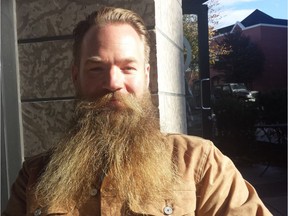 Beard on or beard off? Brian Bates (pictured) and his friends Nicholas Johnson and Braeden Papp are asking the public to make a donation to Victoria's homeless and vote on whether or not they should shave their beards.