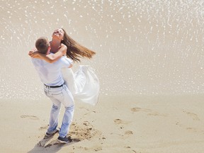 Wedding couple just married near the beach at Hawaii.