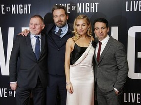 Actors Robert Glenister, from left, Ben Affleck, Sienna Miller and Chris Messina pose for photographers upon arrival at the premiere of the film &#039;Live By Night&#039; in London, Wednesday, Jan. 11, 2016. (Photo by Joel Ryan/Invision/AP)