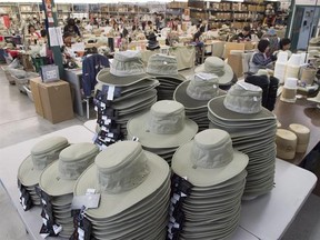 Finished hats sit in piles at the Tilley Endurables factory in Toronto on Thursday January 5, 2017. The maker of Canada&#039;s most iconic hat wants to reintroduce itself. No longer content with solely being known as the purveyor of your grandfather&#039;s favourite wide-brimmed beige chapeau, the chief executive of Tilley Endurables says the company is undergoing a much-needed facelift. THE CANADIAN PRESS/Frank Gunn