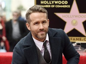 FILE - In this Dec. 15, 2016 file photo, actor Ryan Reynolds poses at a ceremony honoring him with a star on the Hollywood Walk of Fame in Los Angeles. Reynolds has been named Man of the Year by Harvard University‚Äôs Hasty Pudding student theatrical group. The actor who played the title role in 2016‚Äôs ‚ÄúDeadpool‚Äù will be roasted by the student group before being getting his pudding pot on Feb. 3. (Photo by Chris Pizzello/Invision/AP, File)