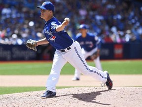 Toronto Blue Jays pitcher Aaron Loup throws against the Cleveland Indians during sixth inning MLB baseball action, in Toronto on July 2, 2016. The Toronto Blue Jays have reached a $1,125,000 deal for 2017 with left-hander Aaron Loup, avoiding arbitration. Toronto exchanged arbitration figures with right-hander Marcus Stroman. The team offered $3.1 million and Stroman asked for $3.4 million. THE CANADIAN PRESS/Frank Gunn