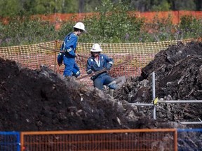 Crews work to contain and clean up a pipeline spill at Nexen Energy&#039;s Long Lake facility near Fort McMurray, Alta., Wednesday, July 22, 2015. Alberta&#039;s research and development agency has a new program in the works that aims to improve pipeline monitoring and spill response by enlisting more indigenous people in the effort. THE CANADIAN PRESS/Jeff McIntosh