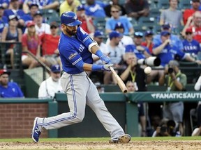 FILE - In this Thursday, Oct. 6, 2016, file photo, Toronto Blue Jays&#039; Jose Bautista connects for a three-run home run off Texas Rangers&#039; Jake Diekman during the ninth inning in Game 1 of baseball&#039;s American League Division Series, in Arlington, Texas. A person with knowledge of the negotiations tells The Associated Press that outfielder Jose Bautista and the Toronto Blue Jays are ‚Äúworking really hard‚Äù to bring him back to the club. The person spoke on condition of anonymity Monday, Jan. 16,