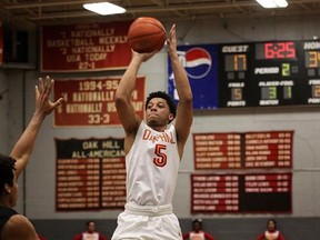 Nova Scotia native Lindell Wigginton shoots under pressure during a game at the Oak Hill Academy&#039;s Turner Gymnasium, in Mouth of Wilson, VA, on January 11, 2017. Modest in size, but draped in history, the 400-seat gym is where the likes of Kevin Durant, Carmelo Anthony and Jerry Stackhouse once famously dominated their opponents as gifted kids, and is now where Wigginton hopes to launch a basketball career as the first Maritimer in the NBA. THE CANADIAN PRESS/Nathan Graybeal