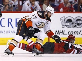 Anaheim Ducks center Ryan Kesler (17) controls the puck in front of Arizona Coyotes left wing Anthony Duclair, right, during the first period of an NHL hockey game Saturday, Jan. 14, 2017, in Glendale, Ariz. Kesler has never played as much in an NHL career that began 16 years ago. THE CANADIAN PRESS/AP, Ross D. Franklin