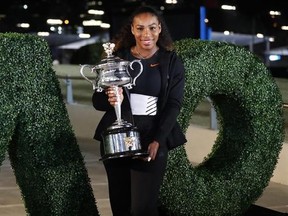 United States&#039; Serena Williams poses with her trophy after defeating her sister Venus to win the women&#039;s singles final at the Australian Open tennis championships in Melbourne, Australia, Sunday, Jan. 29, 2017. (AP Photo/Dita Alangkara)